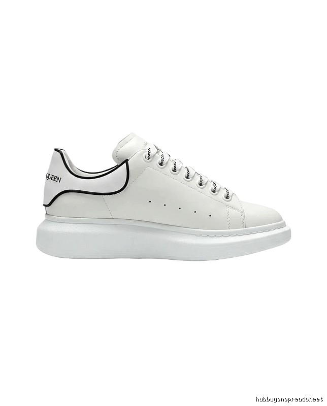 The minimalist style of McQueen white sneakers.