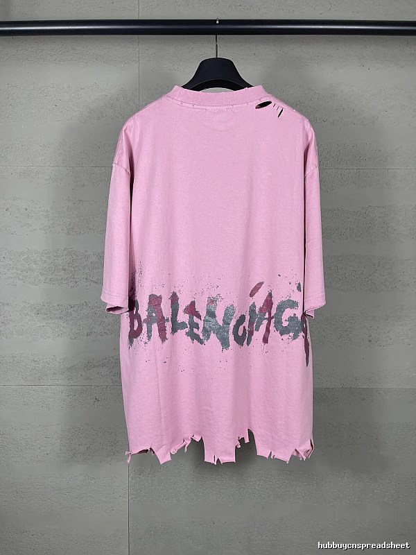 Balenciaga's pink T-shirt with a hole and graffiti style